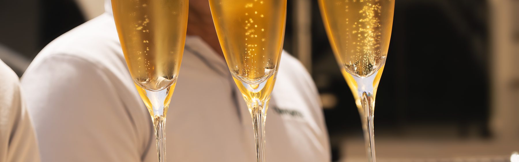 Welcome champagne on a silver tray at the passerelle